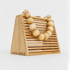 Triangular bamboo beaded handled bag with detachable cross body strap